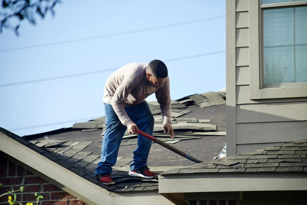 Same home before roof replacement, showing worn and damaged shingles